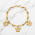 Pulsera Eslabón Rolo con 9 Charms Colgantes y Corazón Pavé en Oro Amarillo 10K - 6.42g