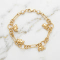 Pulsera Eslabón Paperclip con 4 Dijes de Elefante y Biseles en Oro Amarillo 10K - 5.14g