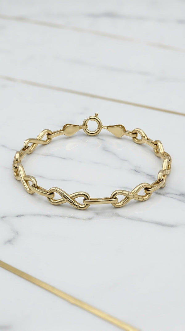 Manilla de Eslabones Infinito Alternados con Cruces Texturizados en Oro Amarillo 10K - 4.80g