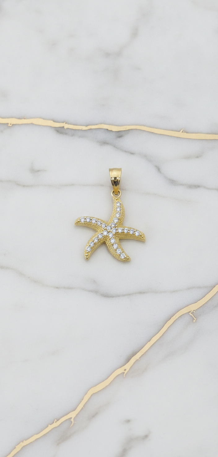 Dije Estrella de Mar con Zirconias en Oro Amarillo 10K (0.94g)