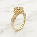 Anillo Cruz Floral de Cuatro Pétalos en Filigrana con Hombros de Zirconias en Oro Amarillo 10K (1.44g)